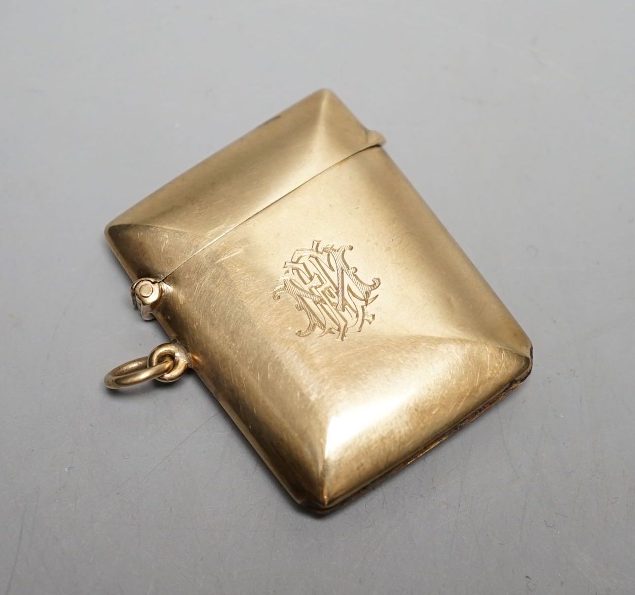 A George V 9ct gold vest case, with engraved monogram, William Neale Ltd, Chester, 1911, 46mm, gross weight 15.2 grams.